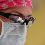 woman with glasses and mask