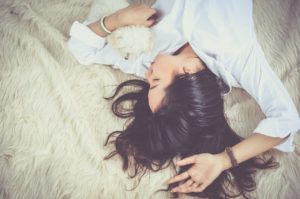 woman laying on carpet